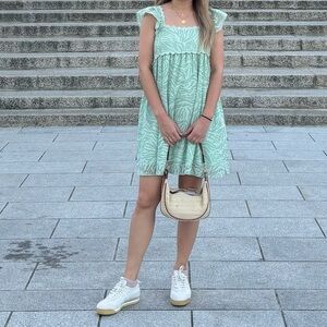 Green mini dress with ruffle sleeves